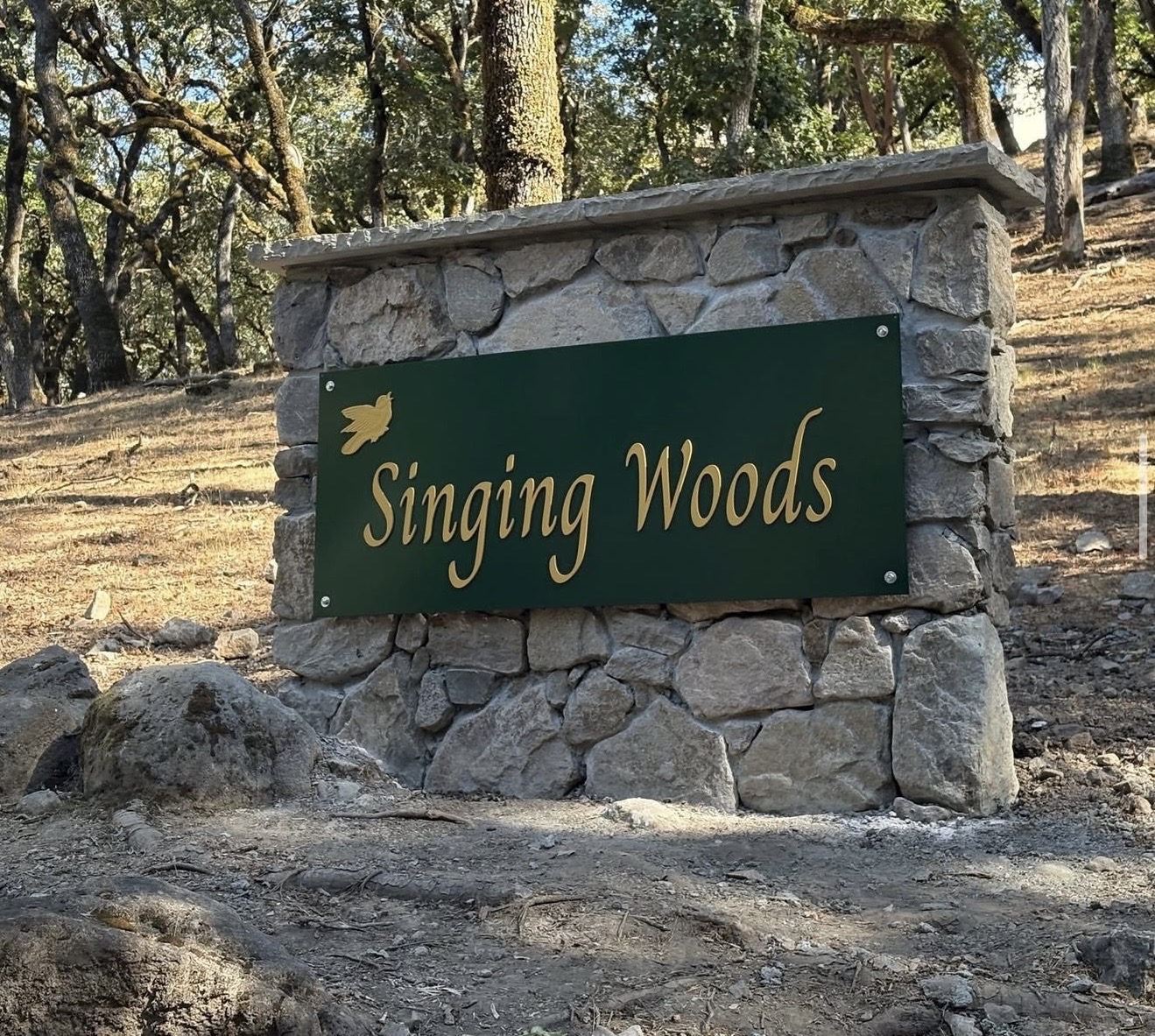 modern stone wall with new sign